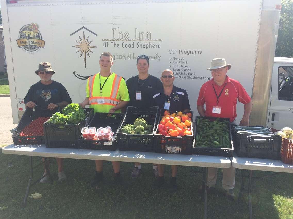 Volunteers & staff at The Inn's Mobile Market visit 17 locations every week throughout Sarnia-Lambton distributing fresh produce.  (Photo courtesy of Myles Vanni)