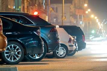 Vehicles parked along a street. File photo courtesy of © Can Stock Photo / Bilanol