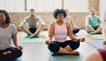 A yoga class being held file photo (Photo by: Rawpixel/ iStock / Getty Images Plus)