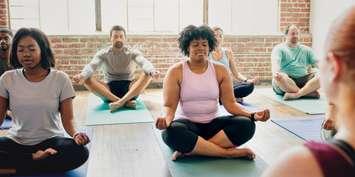 A yoga class being held file photo (Photo by: Rawpixel/ iStock / Getty Images Plus)