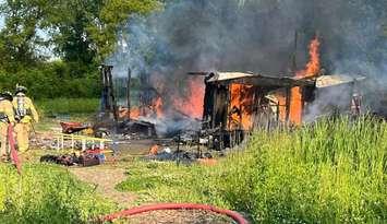 Structure fire reported in the area of Tashmoo Avenue and Churchill Road. June 16, 2025. (Photo courtesy of Sarnia Fire Rescue via Facebook)