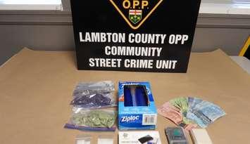 Drugs and items seized by OPP (Image courtesy of the Ontario Provincial Police Lambton County Community Street Crime Unit) 