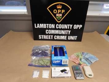 Drugs and items seized by OPP (Image courtesy of the Ontario Provincial Police Lambton County Community Street Crime Unit) 