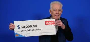 Joseph Murphy of London shows off his $50K lottery win. Photo courtesy of OLG.