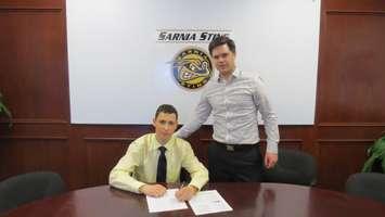Sasha Chmelevski  signs Standard Player Agreement with the Sting. May 21, 2015. photo provided by Sarnia Sting.
