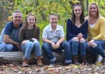 The Stewart family of Sarnia. Ansley (sitting beside her mom far right) will receive brain tumour treatment in 2019 in Texas (Photo via. GoFundMe.com)