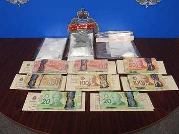 Canadian currency, cocaine and fentanyl that was seized from a residence in Wallaceburg by Sarnia police.  March 2022.  (Photo provided by Sarnia Police Service)