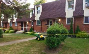 A Pontiac Court townhouse, the scene of a sudden death investigation, is cordoned off with police tape Aug. 3, 2019 (BlackburnNews.com photo by Dave Dentinger)