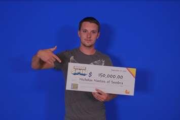 Nicholas Nantais collects his lottery win at the OLG Prize Centre in Toronto. Submitted photo.