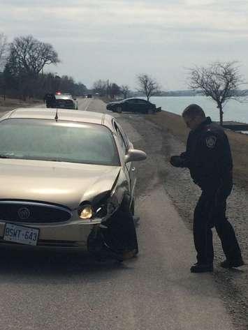Officers investigate a hit and run collision on River Rd. April 7, 2015 (Photo courtesy of Sarnia Police Twitter)