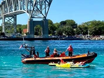 Canadian Coast Guard gives vest-less float down participants Personal Flotation Devices at Blue Water Bridge Sunday August 15, 2021. (Photo by Dave Dentinger)