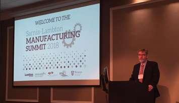 Bluewater Technology Access Centre Project Manager/Research Engineer Rick Williston welcomes people to the 2018 Sarnia-Lambton Manufacturing Summit. January 25, 2018 (Photo by Melanie Irwin)