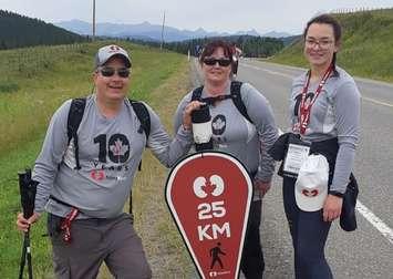 (From left to right) Paul, Kim and Alaina Wright taking part in the 2019 Kidney March in Calgary. September 2019. (Photo from the 'Living of Love' Facebook page)