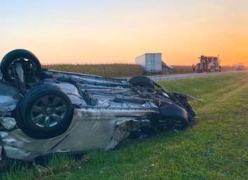 A vehicle on its roof and a transport in a field following a two-vehicle crash in Plympton-Wyoming.  17 September 2021.  (Photo by OPP West Region)
