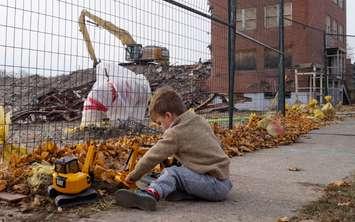Three-year-old Corban Burn plays with his excavator outside the site of the old Sarnia General Hospital. November 12, 2018. (Photo by Colin Gowdy, BlackburnNews)