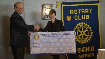 Bluewater Health Foundation Executive Director Kathy Alexander accepts the Rotary Club of Sarnia's latest donation installment of $100,000 during its luncheon Monday. May 2, 2016 (BlackburnNews.com Photo by Briana Carnegie)