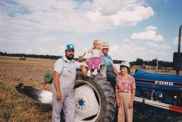 Leonard McNeil (blue hat) with his family. (Photo provided by Barn McNeil)