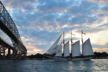 The sun sets on the Tall Ships Festival -Empire Sandy in full sail at Blue Water Bridge Aug. 11, 2019 (BlackburnNews.com photo by Dave Dentinger)