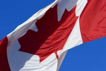 Canadian flag flapping in the breeze. © Can Stock Photo / supertramp