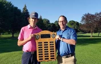 Sarnia Golf Associate Pro Jeff Yates (right) presents Liam Crummy (left) with the plaque for the Junior Boys Club Championship.  August 2021.  (Photo by SGCC)