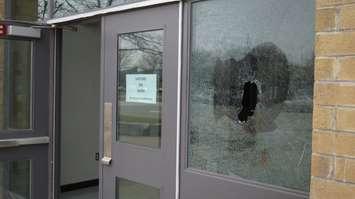 A smashed window at St. Patrick's Catholic High School in Sarnia. 5 November 2020. (BlackburnNews.com photo by Colin Gowdy)