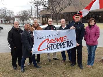 Sarnia Lambton Crime Stoppers members are joined by Sarnia Police Chief Norm Hansen for a flag raising ceremony. January 12, 2019 (Submitted photo.)
