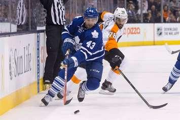 Toronto Maple Leafs' centre Nazem Kadri (43) drives the puck past Philadelphia Flyers' Pierre-Edouard Bellemare during second period NHL hockey action, in Toronto on Feb. 20, 2016. The Toronto Maple Leafs have signed forward Nazem Kadri and defenceman Morgan Rielly to new six-year contracts. Both were impending restricted free agents this summer. THE CANADIAN PRESS/Chris Young