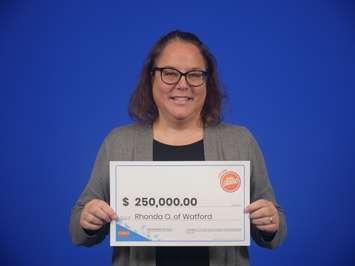 Rhonda Oulds of Watford claims her $250,000 prize from playing OLG's Daily Grand.  (Photo by OLG)