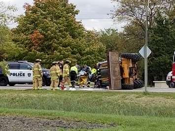 Emergency crews respond to a front end loader that rolled on its side. October 17, 2018 Photo by Mike Harford.