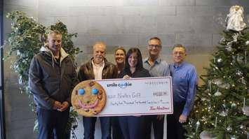 Noelle's Gift Co-Founder Nicole Paquette with Sarnia Tim Horton's owners celebrating the 2019 Smile Cookie campaign. 27 Nov 2019. (BlackburnNews.com photo by Colin Gowdy)
