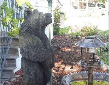 Carved wooden bear stolen from Brigden residence May 2021 (Photo courtesy of Lambton OPP via Twitter)