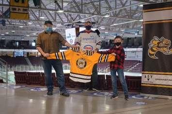 Chef Kevin Allen (left) and 10-year-old Kaleb Orrange (right) being recognized as the winners of the Sarnia Sting and Esso Extra Mile campaign. March 2021. (Photo by Metcalfe Photography)