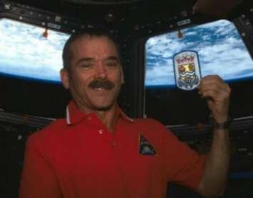 Sarnia born astronaut Chris Hadfield shows off a Sarnia patch while in space. Submitted photo.