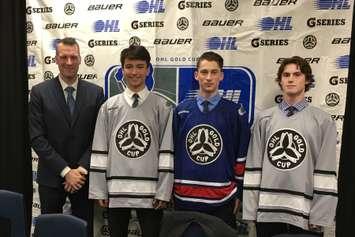 From L-R: Joe Birch, OHL Senior Director of Hockey Development and Special Events, 1st overall pick Ryan Suzuki of the Barrie Colts, 5th overall pick Phil Tomasino of the Niagara Ice Dogs, and 30th overall pick Keean Waskurak of the Mississauga Steelheads. (Photo by Ryan Drury)