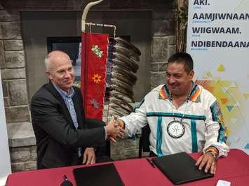 Shell Corunna GM Guy Hackwell (L) and Aamjiwnaang Chief Chris Plain (R) shake hands after the return of land to the first nation - Oct 3/19 (Blackburnnews.com photo by Josh Boyce)