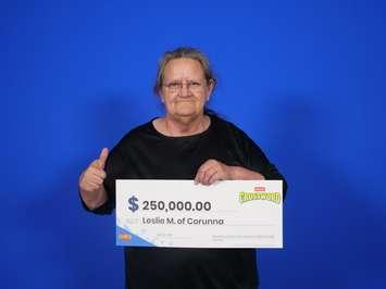 Leslie Miller of Corunna with her winnings (Photo by: OLG)