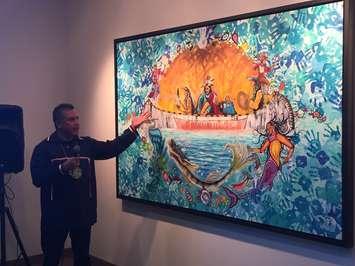 Aamjiwnaang artist John Williams unveils his painting titled "Mookibii" at the Maawn Doosh Gumig, Aamjiwnaang First Nation Community Centre. December 1, 2017 (Photo by Melanie Irwin)
