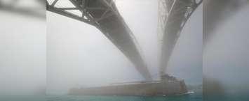 A stiff north breeze meeting hot, humid air had the Blue Water Bridge shrouded in fog Wednesday (BlackburnNews.com photo by Dave Dentinger)