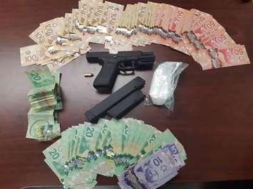 Sarnia Police make significant seizure of $10,000 in cash, cocaine, and a loaded gun. February 27, 2021. (Photo Courtesy of Sarnia Police).