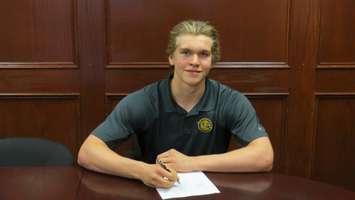 Goalie Aidan Hughes signs with the Sarnia Sting. July 8, 2015. Photo submitted by Sarnia Sting.