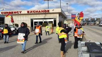 Members of PSAC Local 501 picket at the Blue Water Bridge Currency Exchange after walking off the job. Monday November 21, 2016 BlackburnNews.com photo by Melanie Irwin