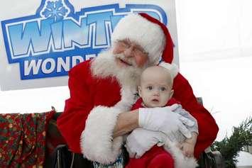 Stanley "Carman" Lamb, pictured here with Levi Irwin, wears the red Santa Claus suit at Bluewater Health Foundation's Winter Wonderland in 2015. Sarnia News Today photo by Melanie Irwin
