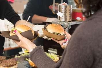 Beef burgers being served. © Can Stock Photo / kasto