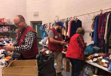 Lowe's workers helping stuff the Salvation Army Chirstmas Hampers. (Photo from the Salvation Army Sarnia facebook page)