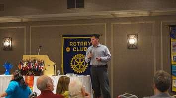 RCMP Constable Devon Jones speaks to the Rotary Club about identity theft June 8,2015 (BlackburnNews.com Photo by Briana Carnegie).