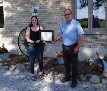 Gracie Goodhill, the recipient of the 2020 Mary Jo Arnold Conservation Scholarship, receives her award from SCRCA Chair, Joe Faas. (Submitted Photo)