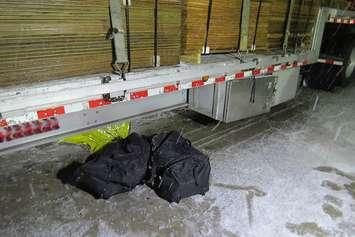 39 kg of cocaine was found in a modified compartment under a flat deck trailer at the Blue Water Bridge November 19, 2014 (RCMP Photo)