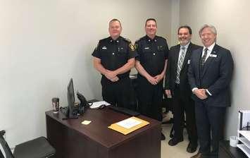 (Left to right) Sarnia Police Chief Norm Hansen, Deputy Chief Owen Lockhart, CRC Manager Brent Gillen and Accident Support Services Ltd. Vice President of Insurance Programs Rick Yates stand in Sarnia's new Collision Reporting Centre. June 11, 2019 Photo by Melanie Irwin.