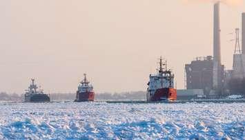 The Canadian Coast Guard Ships Samuel Risley and Griffon escort a commercial ship through heavy ice on the St. Clair River Jan 15 2015.  Photo credit: Richard Dompierre. (Used with permission.)