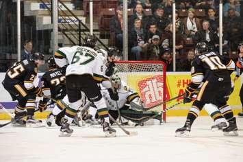 Sting and Knights battle for a lose puck in front of the London net. (Photo by Metcalfe Photography)